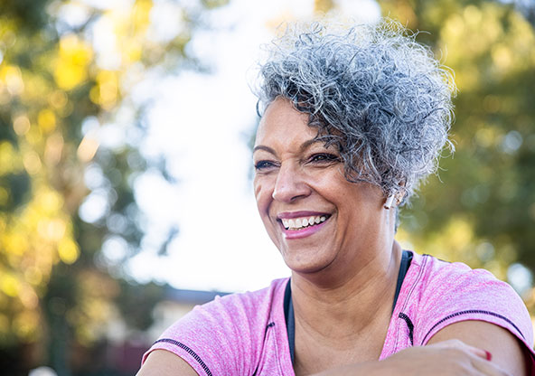 Woman enjoying a walk outside to be healthy. 