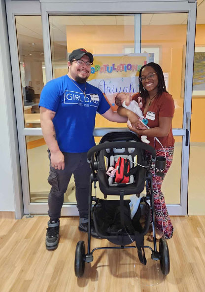 Hernandez family leaving CHRISTUS Children's hospital with baby Ariyah