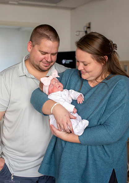 The Speckmans are holding their new baby girl, Lily, who spent 101 days in the NICU.