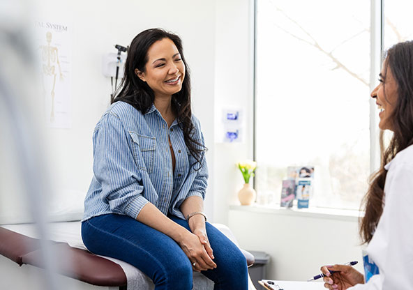 Woman getting a health screening at the doctor's office to make sure she is healthy. 