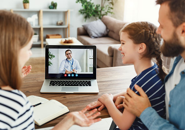 Family taking a virtual care appointment from the comforts of their home. 