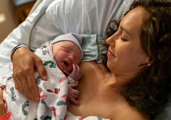 A mother and her newborn baby having skin to skin contact